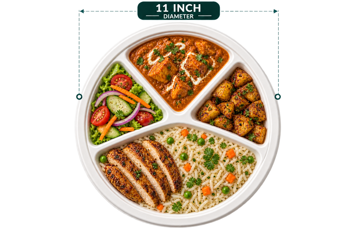 11 inch white bagasse 4-compartment round plate, shown with food (serving suggestion; food not included)